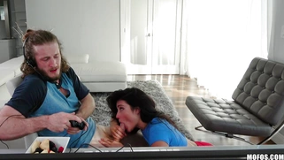 Adria Rae is sucking Brick Danger's cock as he playing video games