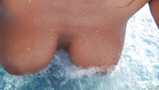 Busty Canadian girl August Ames sunbathing in the pool