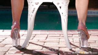 AJ Applegate posing and shaking her big ol' booty by the pool