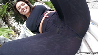 Franceska Jaimes in a leggings posing on the bench in public