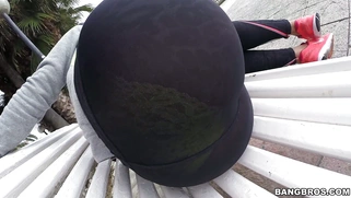 Franceska Jaimes in a leggings posing on the bench in public