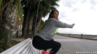 Franceska Jaimes in a leggings posing on the bench in public