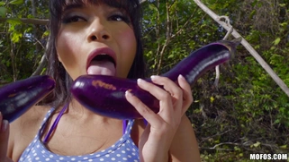 Latina Aryana Amatista plays with vegetables outdoors