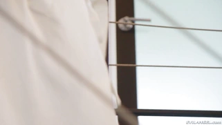 Blonde teen Emma Hix is posing on the stairs