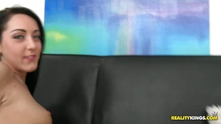 Sabrina Banks laying on the couch and getting her ass fingered