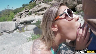 Karma Rx in sunglasses is sucking cock outdoors