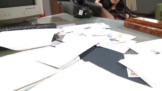 Cigarette smoking babe Amabella teases in an office chair