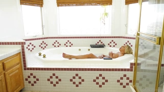 Katie Morgan is playing with her big tits and pussy in the bathtub