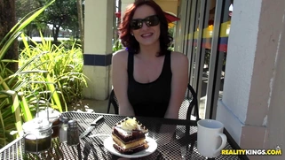 Audrey Grace eating a piece of cake and flashing her natural boobs