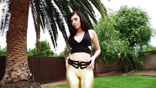 Foxy babe Marley Brinx posing and stripteasing in the garden