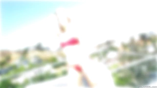 Ashley Fires models a skimpy bikini and and black stiletto heels