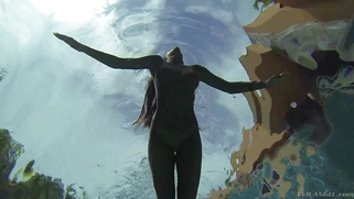 August Ames frolics in a swimming pool with her huge curves