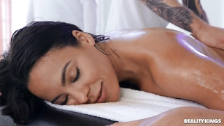 Luna Star gets oiled and massaged on the table