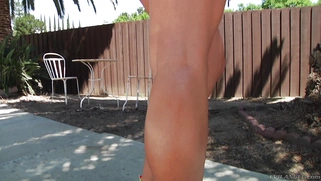 Blonde bimbo Layla Pryce teasing and undressing outdoor