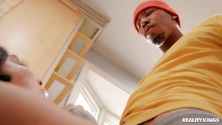 Tokyo Lynn is sucking the black cock in the kitchen