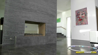 Remy LaCroix balances on the hoverboard and does a hula hoop dancing striptease