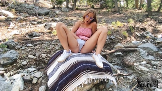 Molly Pills is playing with her pussy outdoors