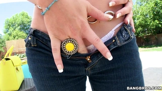 Corinna Blake unleashes her sweet big tits and poses outside