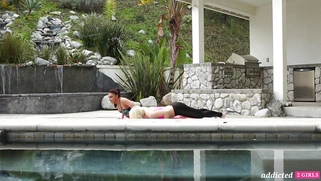 Ash Hollywood and Mischa Brooks are kissing outdoors