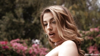 Kristen Scott in sexy outfit is posing outdoors