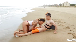 Lola Emme is sucking Jordi's cock in the ocean