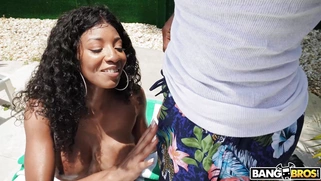 September Reign is sucking the huge black shaft on the sunbed