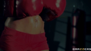 Boxer girl Aryana Augustine hitting the bag in the gym