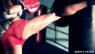Boxer girl Aryana Augustine hitting the bag in the gym