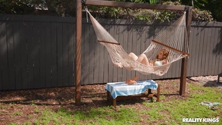 Aria Kai is playing with the dildo outdoors