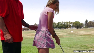 Karla Kush teasing her golf instructor with her short skirt