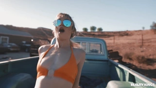 Lilly Bell in sunglasses rides the hard rod with her trimmed twat