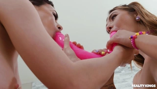 Mia Kay and Olive Glass have fun with dildo