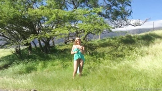 Gorgeous blonde Anikka Albrite posing among cloud-shrouded mountains