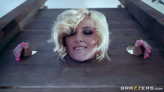 Kate England builds a pillory and offers free anal to everyone