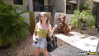 Alexa Kiss is getting picked up outdoors