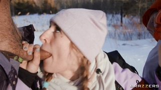 Angel Youngs is sucking two cocks outdoors