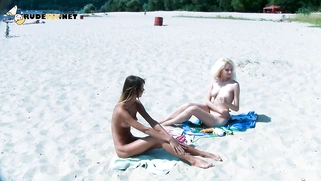 Ravishing nude beach girls tanning