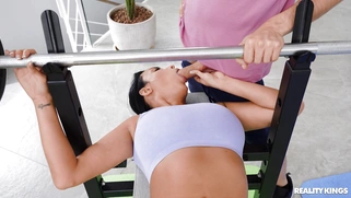 Anissa Kate is sucking Jordi's cock on the gym bench