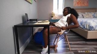 Ebony Elsie in glasses is sucking white cock
