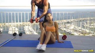 Apolonia Lapiedra and her private trainer are working out on the rooftop
