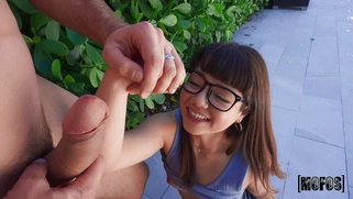 Mochi Mona in glasses is sucking cock and licking balls