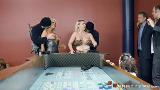 Bridgette B and Nina Kayy show off their huge tits to a pair of robbers