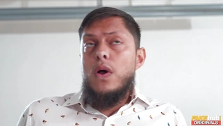 Greta Foss on her knees is sucking Robert Gunner's cock