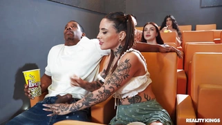 Tabatha Lust is sucking huge black cock in the theater