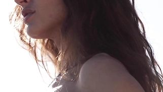 Russian babe relaxing naked at the beach