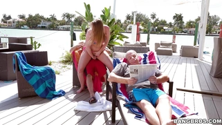 Harley Jade rides cock outdoors behind her grandpa's back