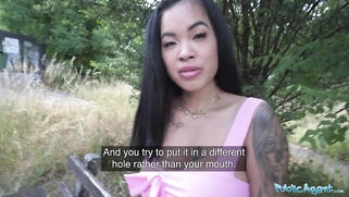 An attractive Asian woman allows him to test her depth by sticking a cucumber into her pussy