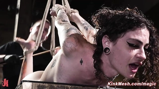 Tattooed slave endures extreme hogtie