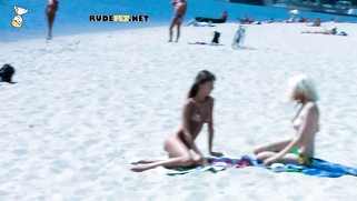 Beautiful blonde nudist sunbathe her trimmed pussy