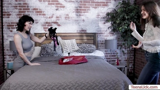 Brunette lesbian fucked by her friend using strap on